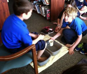 Holy Spirit students washing each other's feet on Holy Thursday 