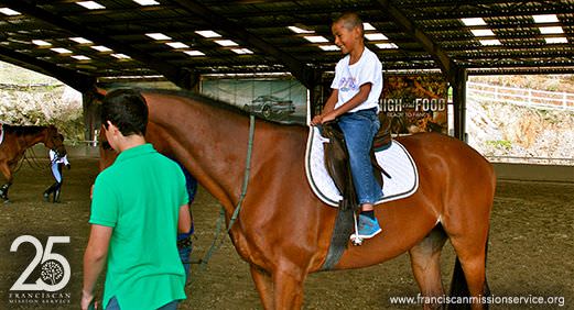 Elías riding a horse during an annual event