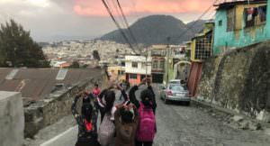 Overseas Lay Missioners Students Walking Down Street with Views of Countryside